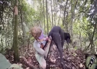 Bodysuit-clad babe fucks her dog in the woods